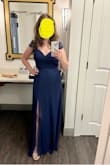 I tried an XS and that was way too small. The size small was a tad bit loose and way too long, but the tie back allows you to tighten the dress! I had the length shortened. It is very dressy and elegant yet not flashy (perfect for me because I'm sort of attention-shy!). I wore it to a gala and it was perfect! The open lace back is gorgeous. - April L.