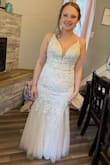 Their is zero stretch so be aware. It is so beautiful though! The straps are thin and long. I had to have them cut. I got a lot of compliments! Buy it! - Elaine T.