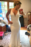 Classy but sexy! Just the look I wanted. Great quality, thicker material, boning in the chest so no bra is necessary! Couldn't be happier that I found the exact dress I was looking for for my small backyard wedding! Ordered a Medium but was too big in the chest area. The small was perfect. Love love love. - Regina D.