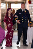 Soooo long. I'm 5'5" and we took 4' off the bottom. The dress then glided across my feet for a much better fit. Besides the obscene length, the dress is gorgeously form fitting. Wrap dresses are my favorite for a flattering look. This isn't the best pic of it with me and the hubby at our daughters wedding, but it'll give you the general idea. I would say this dress runs true to size. Most dresses I purchase with Lulus run XS to S. Just know if you're under 5'9" you will need to hem the bottom. - Kandice M.