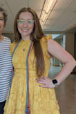 I love this dress! It is made of such a nice, sturdy material, and it looks very expensive and nice. This color is pretty yellow, but that is what I was looking for to match my school's colors! This dress fits my body PERFECTLY! - Jessica H.