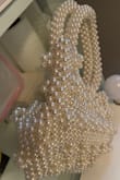 In the picture advertised on Lulus, it appears the bag has a liner bag and is sturdy. When I received the bag, I was so disappointed to see it was unlined and floppy. I came back to the listing to make sure I wasn't missing my lining bag, and sure enough, the description says it's unlined. I liked the pearls so I ended up keeping it and tore off the tag. Well, today I found a very similar one on Amazon that is actually sturdy and lined. I love this style, so I ended up ordering the Amazon version too. Just sad I bought this full priced and can't return it. - Adriana C.