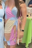 Since it's a wrap dress, you can change how it fits. I love that it hugs my body. It also has a clip on the bust if you want to clip it closed a bit. Lightweight material, comfy, cute! - Natalie T.