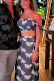 I wore this on our Mexico trip. The material was thin enough that it wasn't too hot. The waist of the skirt was a bit large which made me fidget/ reposition it a little throughout the night, but overall received many compliments. - Susan