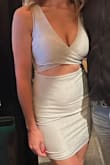 The fit was perfect. Material is stretchy and lined so it's comfortable. It's much more silver than the picture but still really beautiful. I felt sexy and the little extra bit of skin really set it off! - Katrina T.
