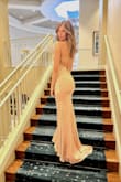 I absolutely love this dress. The back has adjustable strings to allow for the perfect fit around the waist and bust. I am 5'11 and I wore 2" heels with this dress and it was still long enough for me. The fabric quality is very good and it is washable!! I've already washed it and hung it dry and it looks like new! - Preston J.