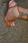 The material is leather hard to tie a bow in the back of the leg tight enough. I bit off more Heel than I can stand unfortunately, they are such cute heels. - Martia S.