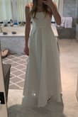 Fit perfectly the fabric is kinda shiny not uncomfortable and perfect for debutants. The dress is pure white not cream and it has a rainbow glow to it in the light. Such a classy style too - Corinne