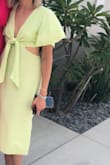 Loved this green color, perfect for summer. Not see-through. Because it's a linen material, it did shrink after washing and drying. You can always line dry but it fits even better after because I have a small bust! Loved everything about it. - Anne W.
