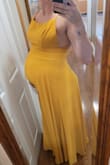 I bought this dress in both the green and yellow. Both fit amazing! Comfortable and non restrictive on my belly. It's hard to find a dress during pregnancy thats both bump friendly and very flattering! I also love that the straps are easily adjustable and the clasp is sewn on very well for durability. I would recommend this dress for both pregnant and non pregnant women - Suze V.
