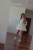 It's a cute fun dress! It's a slight loose on the chest area & I didn't order a size down bc the waist part was already a bit snugged and I didn't want it to be tight. I put a petti skirt underneath it to give it some volume. Wearing it for my reception! - Trena H.