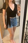 Love this top. The material is soft and the wrap makes it easy to adjust for your preferred amount of cleavage. Only complaint is that the ties are longer than they need to be. Still cute, just too much fabric on the ties. - Deanna M.