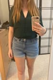 Fits pretty loosely on me, but I think that's how it's supposed to be worn. Material is light but not flimsy feeling. Color is lovely and the neckline is flattering without being too revealing. Overall love it. - Deanna M.
