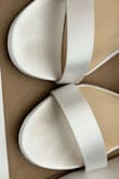 The shoes themselves were very pretty and would have been perfect for my wedding but upon receiving them, they appeared used! You can clearly see someone else wore them already and returned them. I don't know if I was sent a box from the used pile or what. I did not try them on so I have no idea if they would have fit me or not. I'm not confident that if I exchange them, the same thing won't happen so I think I'll pass. - Evelyn L.