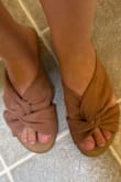 My foot is a little wide, so I got a size up from what I usually get (7) and the shoes fit perfectly!  The material is so soft and I got many compliments on it:) - Irene P.