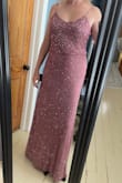 This is a very pretty dress, and the design and shape are very forgiving, particularly for those of us with a little extra in the middle. While it's forgiving, it's also not particularly flattering as it doesn't really accentuate anything in particular. It's also HEAVY due to all the beading, and in the few minutes I had it on my upper arms were a little irritated. But things to be expected with this style of dress, but not things I want to deal with when the dress looks just ok. The color wasn't great for my skin tone, either, which probably didn't help.
The length was perfect with 3" heels and the straps are adjustable. - Erin W.