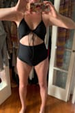 Very cute chic 70s vibes just a tiny bit small, the straps are just a bit tight and my back fat is a bit squished but that's not the suit's fault. I wish I could try on a L but I think I would be in between sizes. - EJ S.