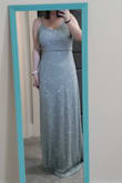 Absolutely stunning! Fits perfectly! The beading is exquisite and for the price! What a bargain! It's a bit heavy but not a huge issue. It's also a bit long but that's expected since I'm on the shorter side. I'm just going to get it hemmed. The beading does get a bit scratchy under the arms and I wish it had thicker straps to hold the weight of the dress but that's just me being picky. All in all it is lovely! - Holly Y.