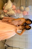 The dress was super cute! It was a tiny bit big but nothing crazy. The dress has two layers a solid layer then a layer with the design. The dress is great quality! - Monica M.