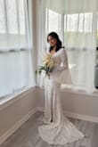 I purchased this dress for my wedding and it did not disappoint. Runs a bit small but I didn't need to size down. I got so many compliments and I felt beautiful. - Pamela T.