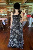I loved wearing this dress and received many compliments on it! The material is silky and lightweight with a flowy skirt, perfect for the outdoor summer wedding I attended. The skirt is a bit long, so heels with this are a must at my height. My only complaint is that the bust area needs to be taped down with fashion tape in order to sit flat on the sides - you can see what I mean in the photo. Even with tape, in my case, it still stuck out a bit at the sides, but it's possible this just depends on the bust size (I'm on the small/medium side). Still, I can't wait to wear this again to a future event! - Kelsey L.