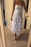 I purchased this dress for my bridal shower in September and I really love it! Just needs a quick steam, otherwise, it's exactly what I was looking for. The dress itself is a great material. Lightweight, comfortable and flattering. Can't wait to wear it next month! - Leanne L.