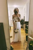 I loooove it. It's very cute, I wore shorts under it because I forgot to use skin tone underwear (it isn't that see-through, but I felt more comfortable using it). Just be careful washing/drying it, I made the mistake of washing it before using it for my elopement and the dryer shrank the skirt. It was super long covering my feet and after looks like it is in the picture. I had to wash it again and now it's even shorter (the top shrank too). Do not make the same mistake as I did, I'm not sure about the wash recommendation because I didn't see any, but be aware of that! I felt that I lost a really cute dress, but besides that problem, I'd buy it again. - Andressa D.