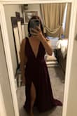 This dress is stunning on! I did size down based on reviews. I normally wear a S/M. 

Being 5'2, I knew I would need to have the dress hemmed. There are three layers to the dress, but only two need to be hemmed.

I also have to have the shoulder area hemmed. I love that there is sticky, rubber like adhesive at the shoulders. - Tara G.