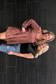 The fabric is thick and great for cooler weather. It, however, doesn't have a lot of stretch to it. I just tucked it in and didn't snap it to be more comfortable. - Heather R.