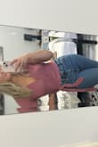 I usually wear a small from Lulus but I ordered up so this shirt wouldn't be too cropped. At one size up it hits right where most of my high wasted jeans end. The material is very soft. I've been thinking about ordering in another color. - Heather R.