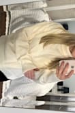 I ordered this sweater one size up because I wanted it to be a little looser and more comfortable. The fabric is so soft I love it! - Heather R.