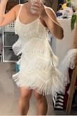 The color is off-white. The sequin is minimal, it doesn't have that whoa shine but it/'s super cute and the fringe is fun to wear. The fabric is quite stretchy but I wouldn't size down. The length is perfect for me since I'm only 5'1". - Ann L.