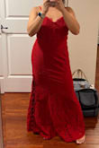 I had to get this dress hem because I'm short but it fits nicely. The slit is on the left leg and doesn't show much leg unless you're sticking your leg out to the side. It's slight stretchy and very comfortable. - Ann L.