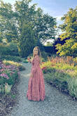 I wore this to a garden wedding last weekend and felt absolutely amazing in it! I got so many compliments. The material is just beautiful and the bottom has a weight to it that just flows beautifully, but didn't feel heavy. The rose color is something I normally wouldn't choose, but Im so glad I did. I sized up to a large so it would close over my chest (and not show so much cleavage), but otherwise true to size. You need this dress! - Gerry O.