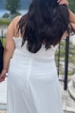 I love the dress. It's a beautiful white and it's a gorgeous material. It's kind of a heavy dress. So I have a wide back which is why I sized up and the dress was still kind of tight. Also since I sized up I think the chest opening was too big for me and my boobs kept popping out lol. Everything else fits fine, so if you have a wide back or a bigger chest I recommend sizing up. - Abigail R.