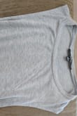 Love this top, it's relaxed but cute and can be dressed up or down. I have the pink color and heather grey just be forewarned that the grey is a true plain grey color, not Heather (light grey) as shown in the model's picture. In reality it's much darker. I was bummed because I love heather grey but oh well. Still cute! - Kim L.