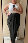 I was skeptical of buying this skirt cause oh how it shape. Because I'm short and I wasn't sure if the back will drag in the ground. So Bought the large size based on reading the reviews they run a little small. Immediate love it every thing about it. Bought this skirt for my up coming trip to Europe so excited to wear this. I'll  Definitely will recommend this skirt. - Gemma M.