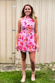 I purchased this dress for my sister in laws wedding shower. It was really cute and I got a lot of compliments. The fit was a little tight in the bust and a little short for me, but I have really long legs. I probably would have purchased a medium just to feel a little more covered. - Julia R.
