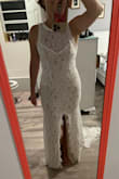 This dress is gorgeous and such a great price. The quality is good, fabric is nice.
Sizing is weird though.
I originally ordered a Medium. It was very tight in the hips as the lace is non stretch. It fit great everywhere else.
I exchanged it for a Large and there was NO difference in the hips, but upper portion was larger.
I called and told them I thought the Large was a flawed garment so they sent out another large to see if they were all like that. The second large was a bit bigger but there should be at least a 2" increase between M and L in all body width and there isn't.
Basically, if you have wider hips, this dress will probably not fit you. It was created for ladies without curves.
I work in apparel development so I can sew and I will be adding additional lace applique in the hips area so that I can let the dress out in that area as the seam allowance used on this dress is incredibly minimal. - Sarah G.