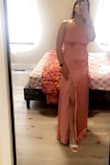 Good clothing with a lining underneath satin. Doesn't stick which makes it look great! Lovely decent color and is not immensely bright. Loved it for my bridal shower. Just paid extra $31.00 for custom clearance. Other than that, beautiful - Samarpreet K.