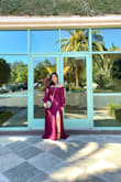 This dress ran true to size for me. I ordered the same dress in a different color a few months before and I loved it so I had to get another one. I got a large in my burgundy dress and it fit just right. In my green one, I ordered an XL and had to alter the length a bit but I liked how I was able to lift the sleeve to cover my shoulder since it was a little big. - MELANIE A.