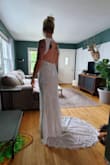 The dress is beautiful, but I will have to alter it. The fabric around the neck is too long and the slip shows in the front. - Angela F.