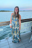 I am absolutely in love with this two piece maxi dress! It was adorable and I got lots of compliments on it. I thought that the skirt fit great but was extremely long on me. I was able to tie the sides up a bit so that I could walk. The top of the dress was a bit loose, I tied it as much as I could but it was not tight. I taped in my chest so that might have also been the reason it was not too snug on me. - Anna H.