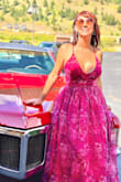 This was such a fun gown to wear! The colors are gorgeous! Purple and red. I ordered a medium, that usually fits well, but it was a little too small. The large fit great and I received so many compliments. I would recommend steaming out the gown before wearing it. I love this gown and can't wait to have an excuse to wear it again. - Emer M.