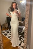 It doesn't look like a showstopper on the website, but I love it on. Decided to order a size larger than my usual dress size of Small to accommodate my hips with a little more room in the thighs. I would say this runs small bc it is way tighter than on the model. Got the medium and will have it tailored slightly in the waist. Great for a pear shape bc of the flutter sleeves to balance the overall impression. There's something very classic about this dress. Perfect. - Marlane B.