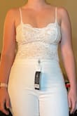 I am normally not a bodysuit person, so was unsure how I would like the fit/feel, but I am in LOVE! We are doing a courthouse wedding this year (traditional one next year) and I opted for this paired with some white flare jeans, perfect for what we are going for! I was a little nervous between a Medium or Large but loved how the medium fit me! I had thought there would be a bit of support in the chest area, and there is not so I will be looking for a strapless bra to keep the girls in check for photos! - Megan M.