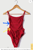 I was so excited to get this suit in the mail.  The material and color are beautiful and the fit is almost perfect.   The bottom loops for the drawstring are in the wrong place.  I requested an exchange for the same size but the replacement suit has the same issue.   The loops need to be farther down on the back seam.   The photos on your website show a beautiful tie in the back but the actual ties on the suits I received don't lay right.  I have attached two photos.  One from your website and one of the suits I received.   The blue arrows indicate the incorrect placement.  The yellow arrows indicate where the loops should be. - Kimberly G.