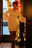 This dress is flattering and feels so stylish.  It is very fitted, the material is high quality and not too short. This is a classic. - Emer M.