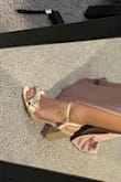I felt the strap might be a SMIDGE tight but not bad. The shoe fit overall good. But I love the bow. Love the satin material. Very cute overall. - Aly V.