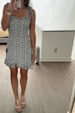 Dress is short but really cute and comfortable! I like the strap ties! - Ariel P.